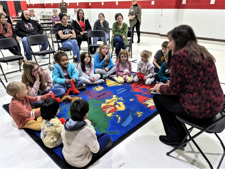 Book Bus volunteer reading to students at Delshire Elementary.